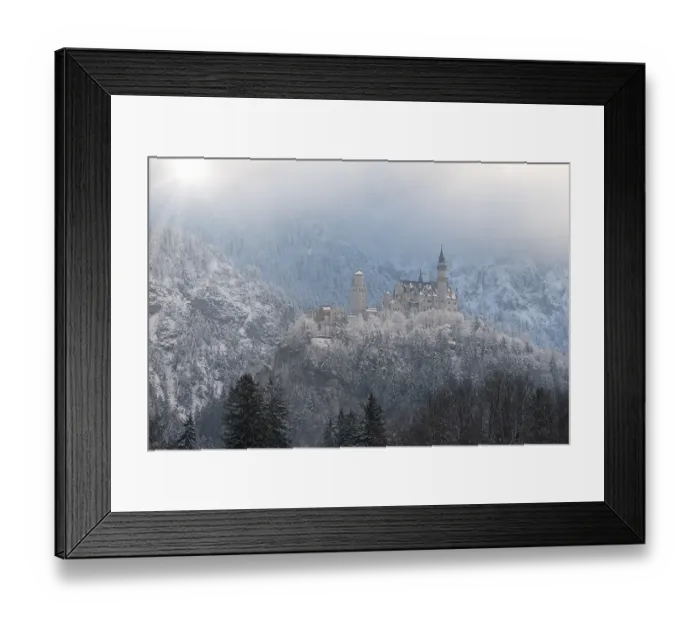 Framed Print : Castle enthroned on a snow-covered hill
