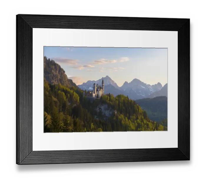 Framed Print : Castle rises majestically in front of an alpine panorama in the evening Framed Print : Castle rises majestically in front of an alpine panorama in the evening