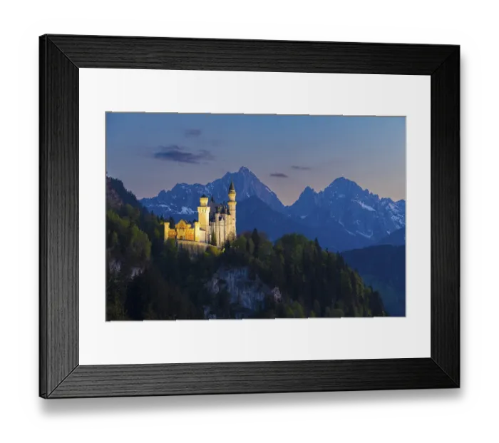 Framed Print : Illuminated castle against a mountain backdrop at night Framed Print : Illuminated castle against a mountain backdrop at night