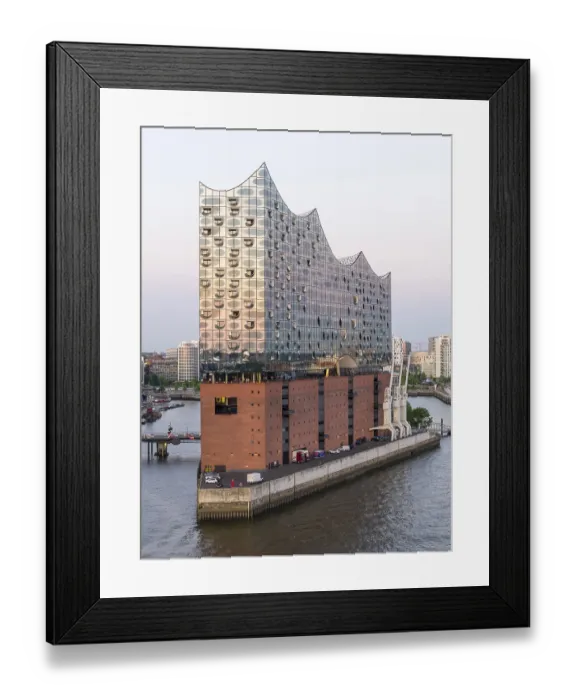 Framed Print : The Elbphilharmonie concert hall in Hamburg is reflected in the glass design above the historic Kaispeicher warehouse