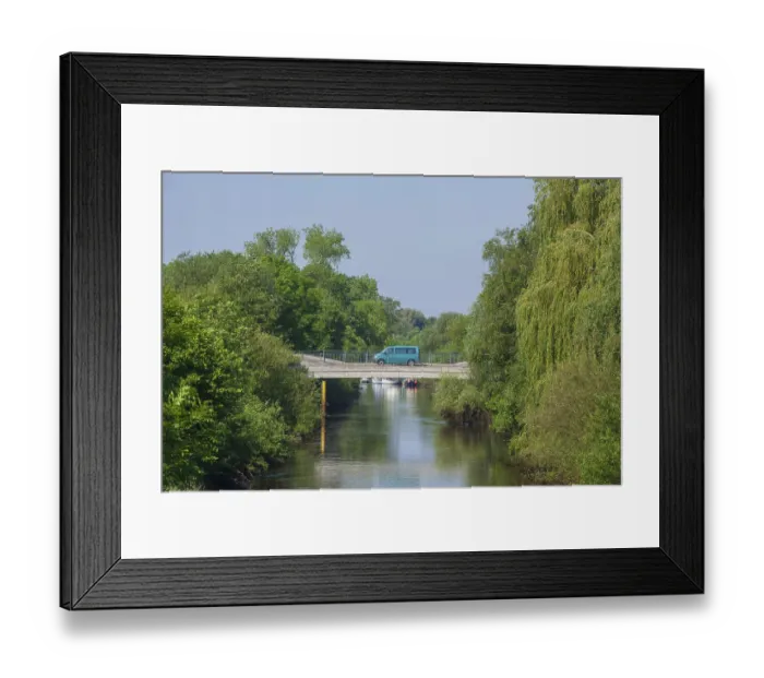 Framed Print : Road bridge with delivery van over the river Wumme in spring