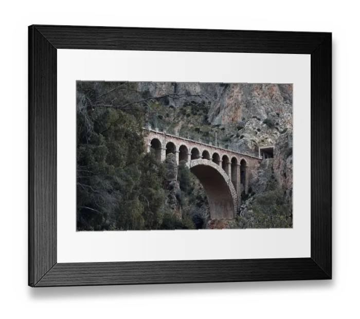 Framed Print : Historic viaduct in a rocky, wooded landscape on the Caminito del Rey path