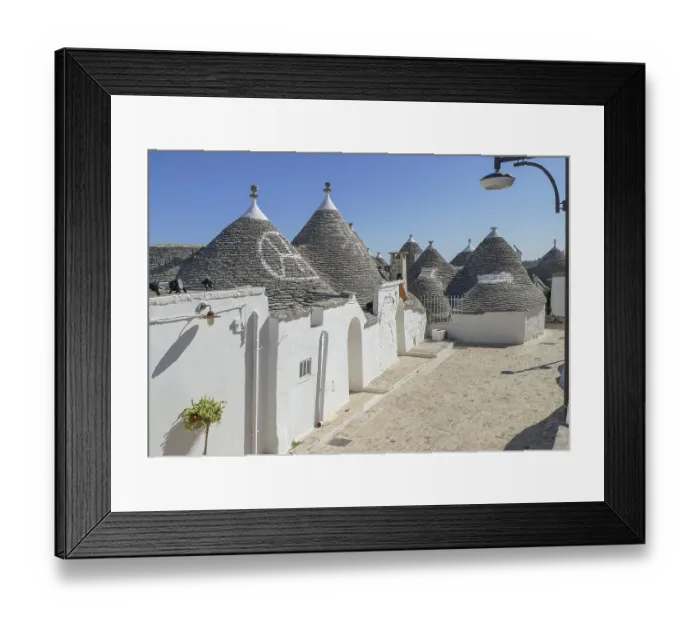 Framed Print : Sunny impression of trulli houses at a town named Alberobello in Apulia Framed Print : Sunny impression of trulli houses at a town named Alberobello in Apulia