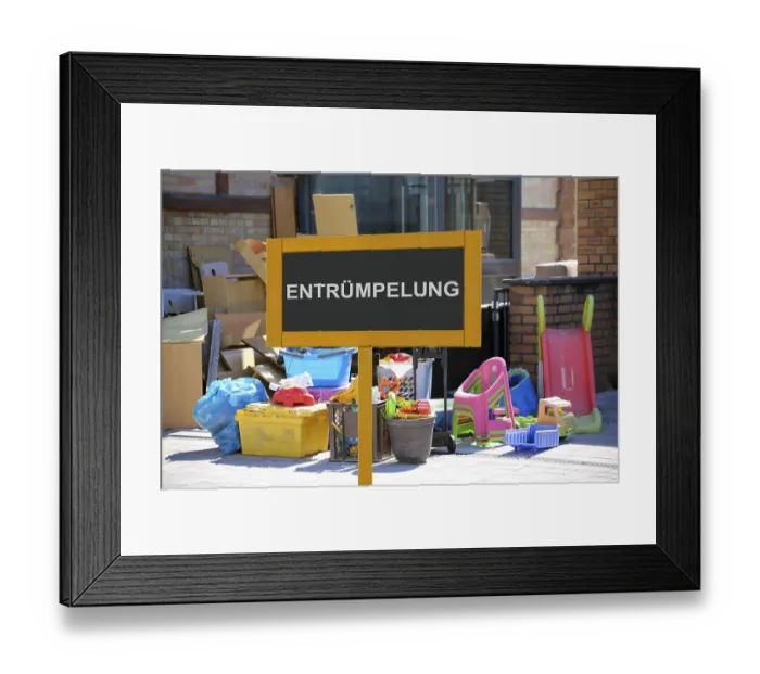 Framed Print : (Photomontage) Sign with the inscription ENTRUMPELUNG vor Sperrmull at a residential building (Photomontage)