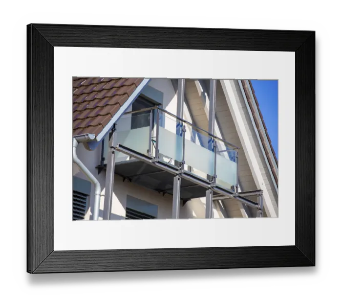 Framed Print : Balcony railing made of glass and stainless steel on a residential building