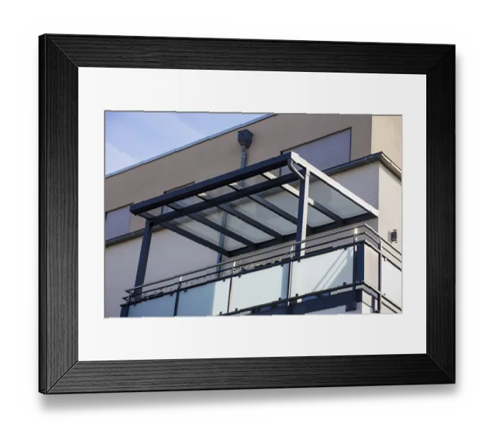Framed Print : Beautiful balcony roofing made of glass and aluminium on a residential building