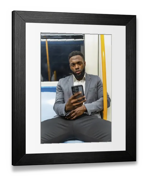 Framed Print : Young businessman commuting on a subway train
