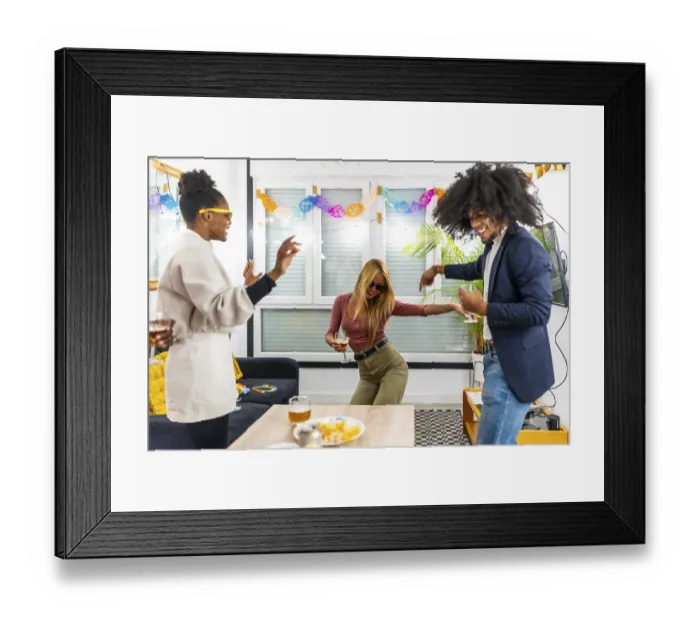 Framed Print : Blonde woman dancing next to multi-ethnic friends and having fun drinking beer at home party Framed Print : Blonde woman dancing next to multi-ethnic friends and having fun drinking beer at home party