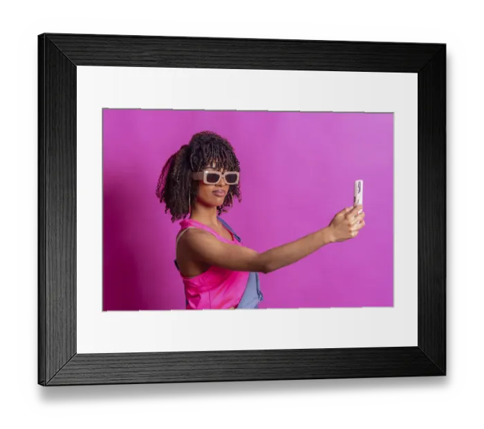 Framed Print : Fashionable young woman taking a selfie with smartphone