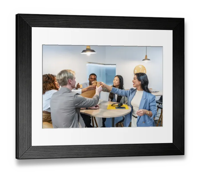 Framed Print : Multiethnic business team toasting together with coffee