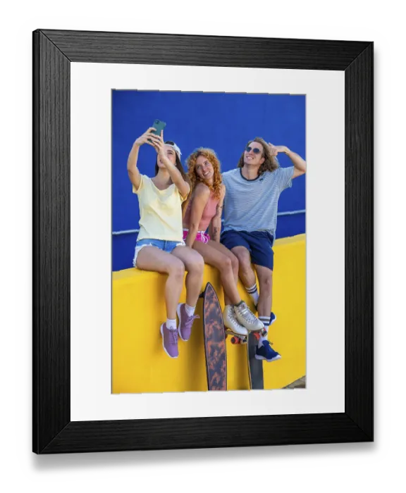 Framed Print : Three friends sitting on a yellow wall