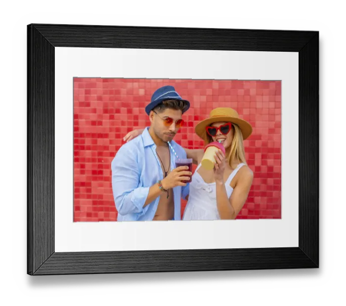 Framed Print : Happy couple enjoying colorful beverages on a summer day