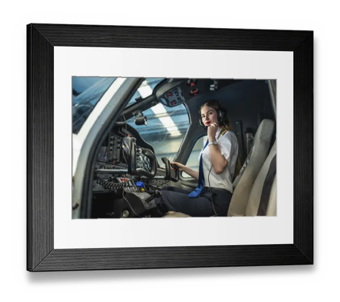 Framed Print : Confident female pilot preparing for takeoff Framed Print : Confident female pilot preparing for takeoff