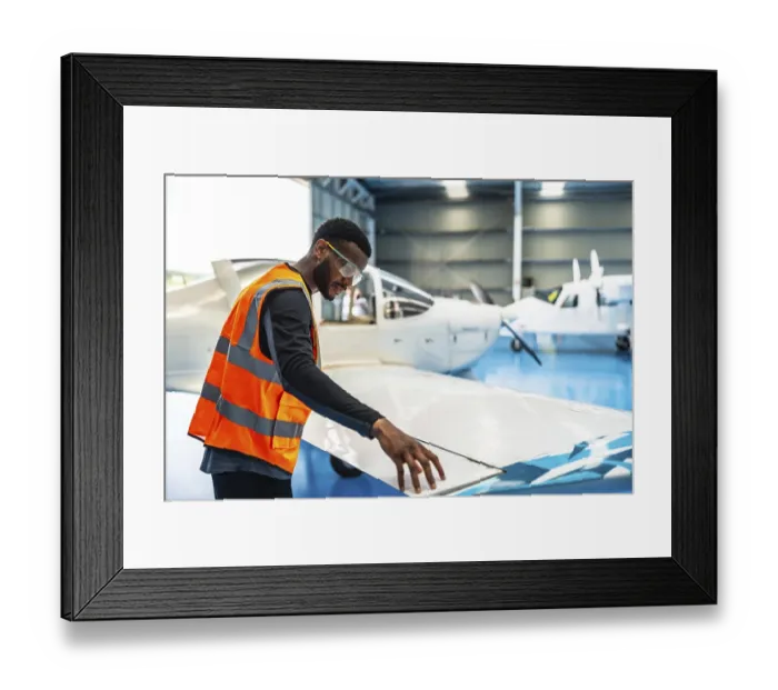 Framed Print : Aircraft maintenance engineer wearing safety glasses