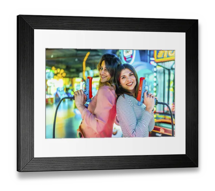 Framed Print : Two joyful women standing back to back