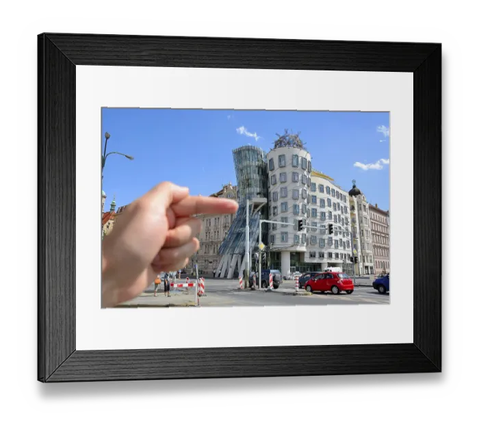 Framed Print : Hand pointing at the famous dancing house in prague