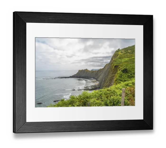 Framed Print : Breathtaking view of the flysch cliffs meeting the ocean waves at sakoneta beach in zumaia