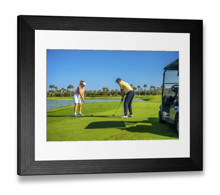 Framed Print : Father and daughter duo playing golf on a sunny day