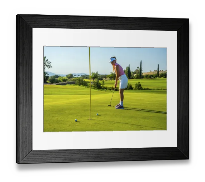 Framed Print : Professional golfer concentrating on putting the ball into the hole on a sunny day at the golf course Framed Print : Professional golfer concentrating on putting the ball into the hole on a sunny day at the golf course