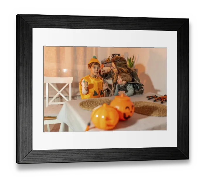 Framed Print : Mother applying halloween makeup on her children