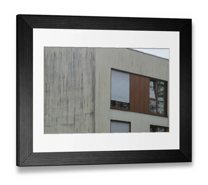 Framed Print : Streaks of dirt staining a building's facade