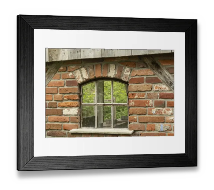 Framed Print : Borken, NRW, Germany, Old arched window with weathered wood and red bricks reflecting green trees