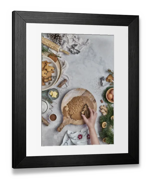 Framed Print : Top view of an anonymous woman preparing desserts for christmas at a table with christmas decorations