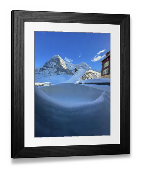Framed Print : Hotel and Snowcapped Mountain Peak Eiger North Face at 3970 Meter High in a Sunny Winter Day with Blue Sky