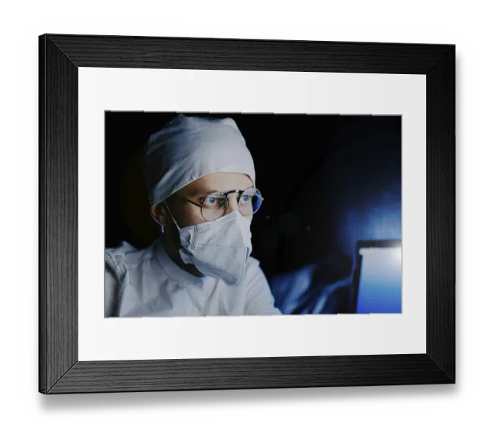 Framed Print : Masked professional in dark, illuminated by blue light Framed Print : Masked professional in dark, illuminated by blue light