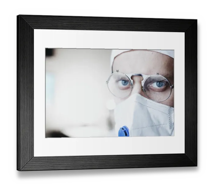 Framed Print : Close-up of a doctor with glasses and face mask Framed Print : Close-up of a doctor with glasses and face mask