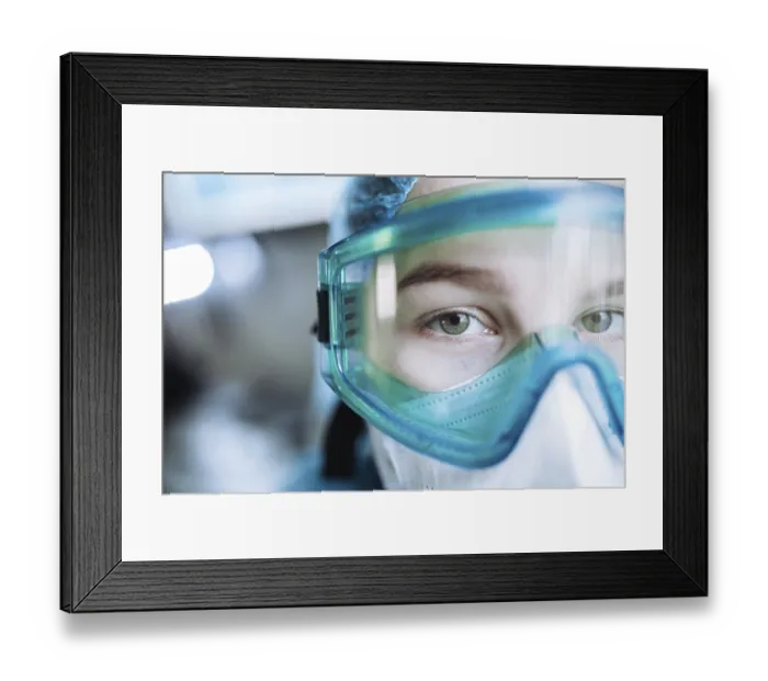 Framed Print : Professional in a clinical environment wearing a medical mask and goggles Framed Print : Professional in a clinical environment wearing a medical mask and goggles