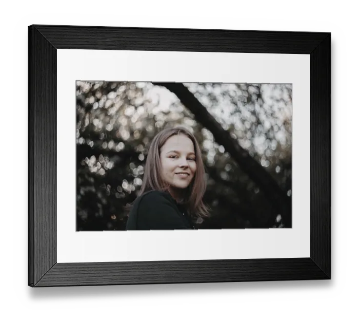 Framed Print : Close-up of smiling woman in a natural setting with soft focus Framed Print : Close-up of smiling woman in a natural setting with soft focus
