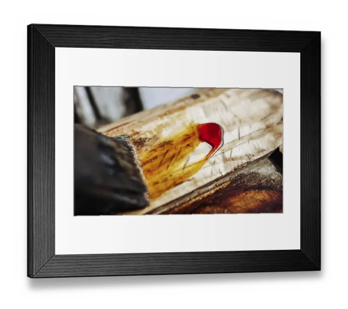 Framed Print : Wood being stained with yellow and red hues