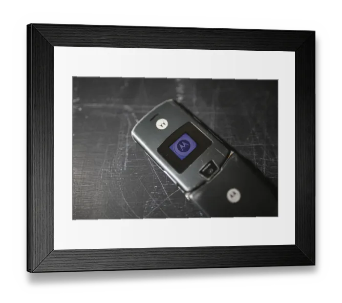 Framed Print : Close-up of a Motorola flip phone with its external display Framed Print : Close-up of a Motorola flip phone with its external display