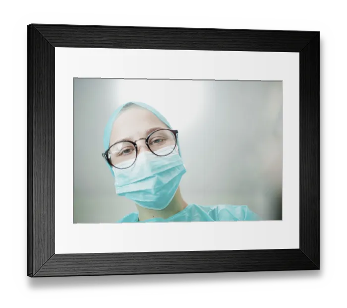 Framed Print : Close-up of a focused surgeon in mask and glasses Framed Print : Close-up of a focused surgeon in mask and glasses