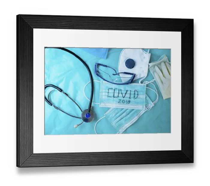 Framed Print : Medical equipment including stethoscope and mask on blue backdrop