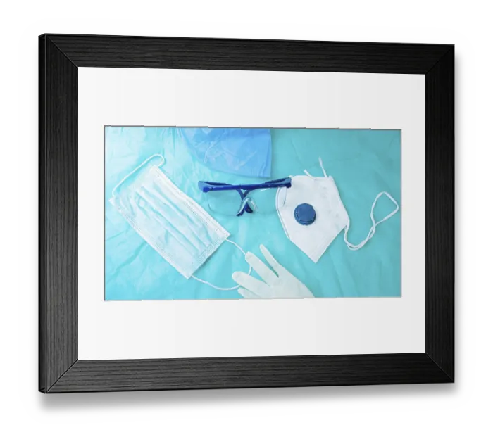 Framed Print : Protective gear spread on blue surface including a mask