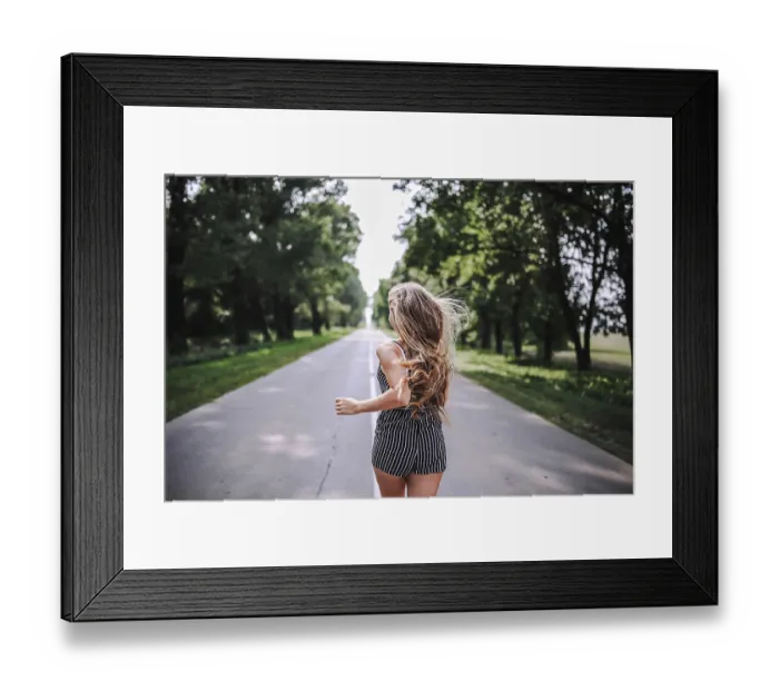 Framed Print : Girl with flowing hair running down a tree-lined road on a sunny day Framed Print : Girl with flowing hair running down a tree-lined road on a sunny day