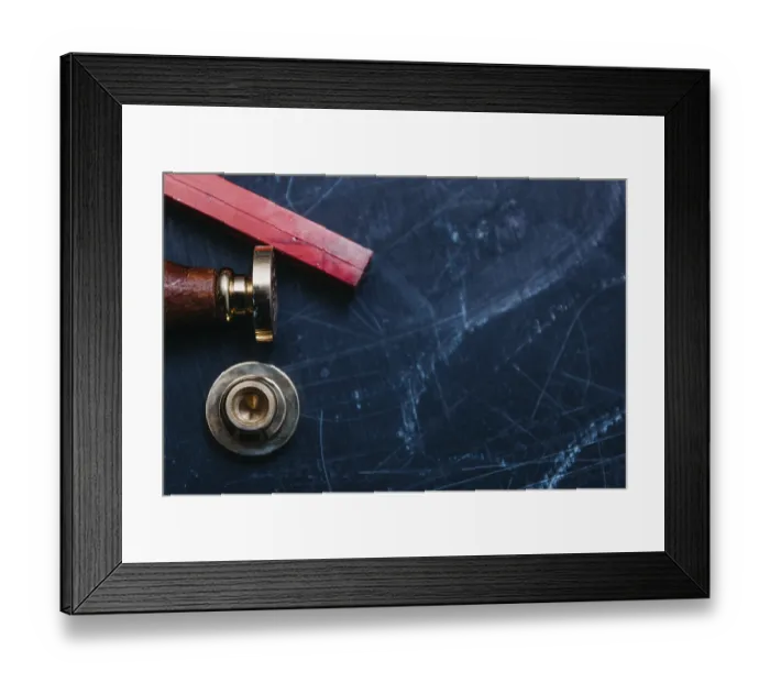 Framed Print : Wax seal components on a scratched blue surface