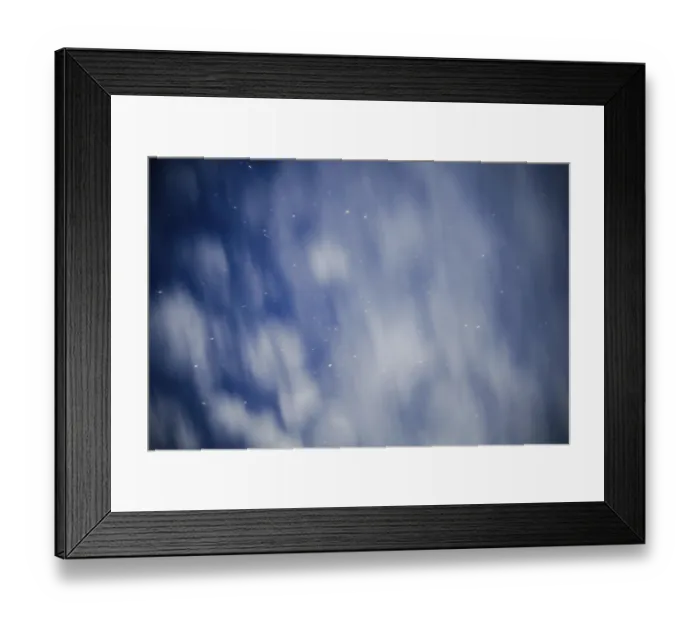 Framed Print : A night sky with blurred clouds and scattered stars creating an ethereal atmosphere