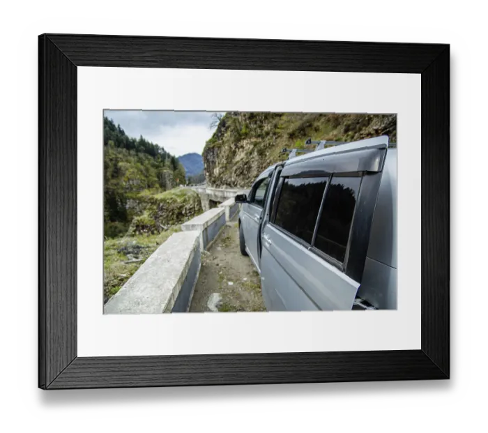 Framed Print : Minivan on a mountain road with scenic views Framed Print : Minivan on a mountain road with scenic views