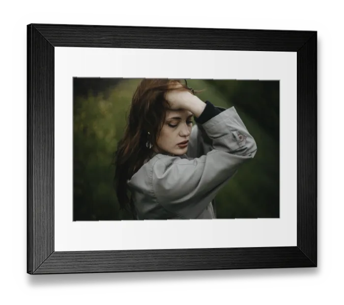 Framed Print : A woman in contemplation with a green backdrop