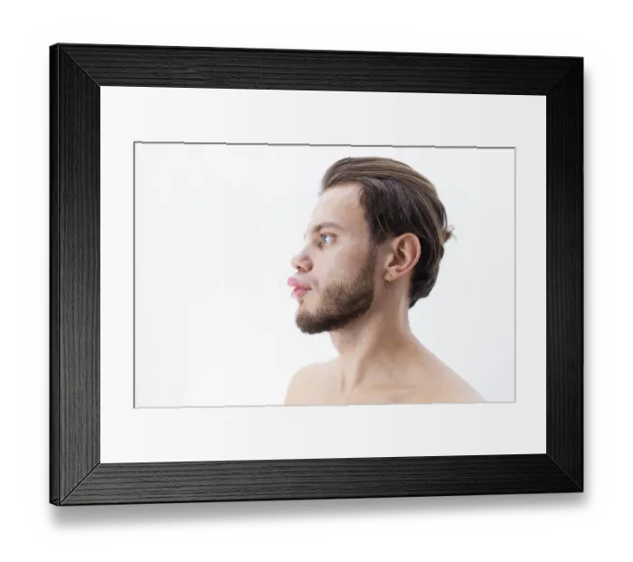 Framed Print : Profile view of a bearded person looking ahead against a white background