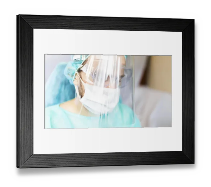 Framed Print : Person wearing medical attire looking thoughtful with full protective gear Framed Print : Person wearing medical attire looking thoughtful with full protective gear