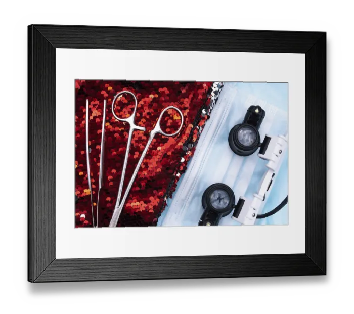 Framed Print : Medical tools and goggles placed on sequins alongside a surgical mask
