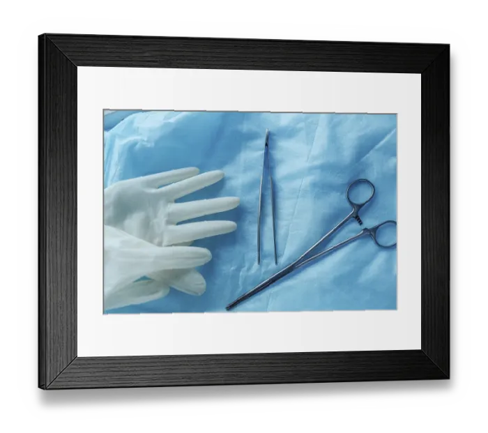Framed Print : Surgical tools and gloves on blue cloth Framed Print : Surgical tools and gloves on blue cloth