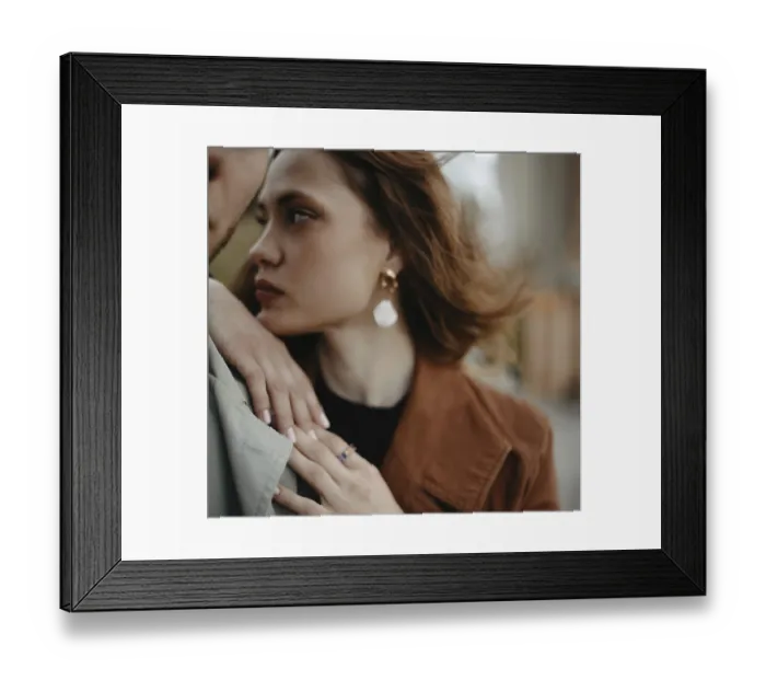 Framed Print : Close-up of a woman with the wind blowing her hair Framed Print : Close-up of a woman with the wind blowing her hair