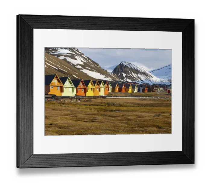 Framed Print : Colourful wooden houses in Riehe