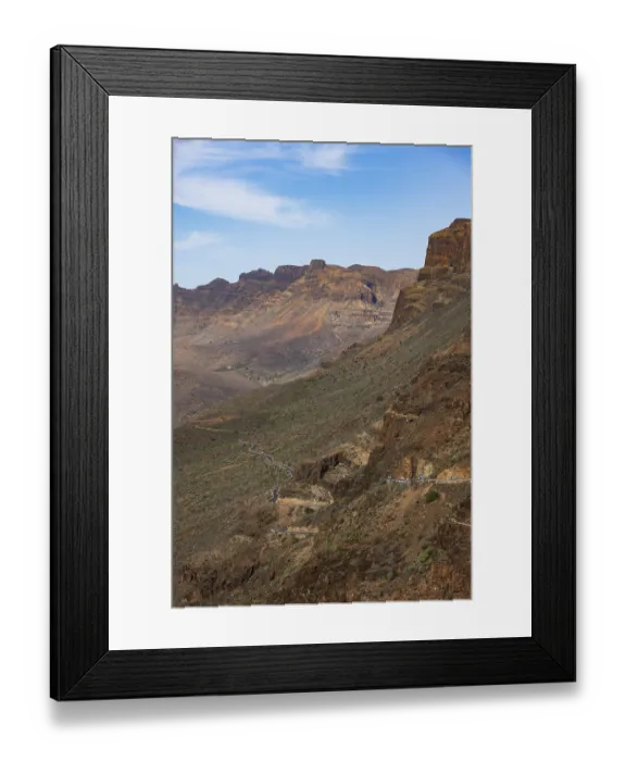 Framed Print : Mountain road at the Degollade de las Yeguas viewpoint with a view of the Barranco de Fataga