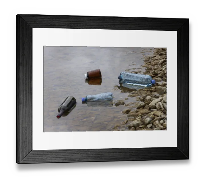 Framed Print : Environmental pollution, Household waste washed up on the lake shore